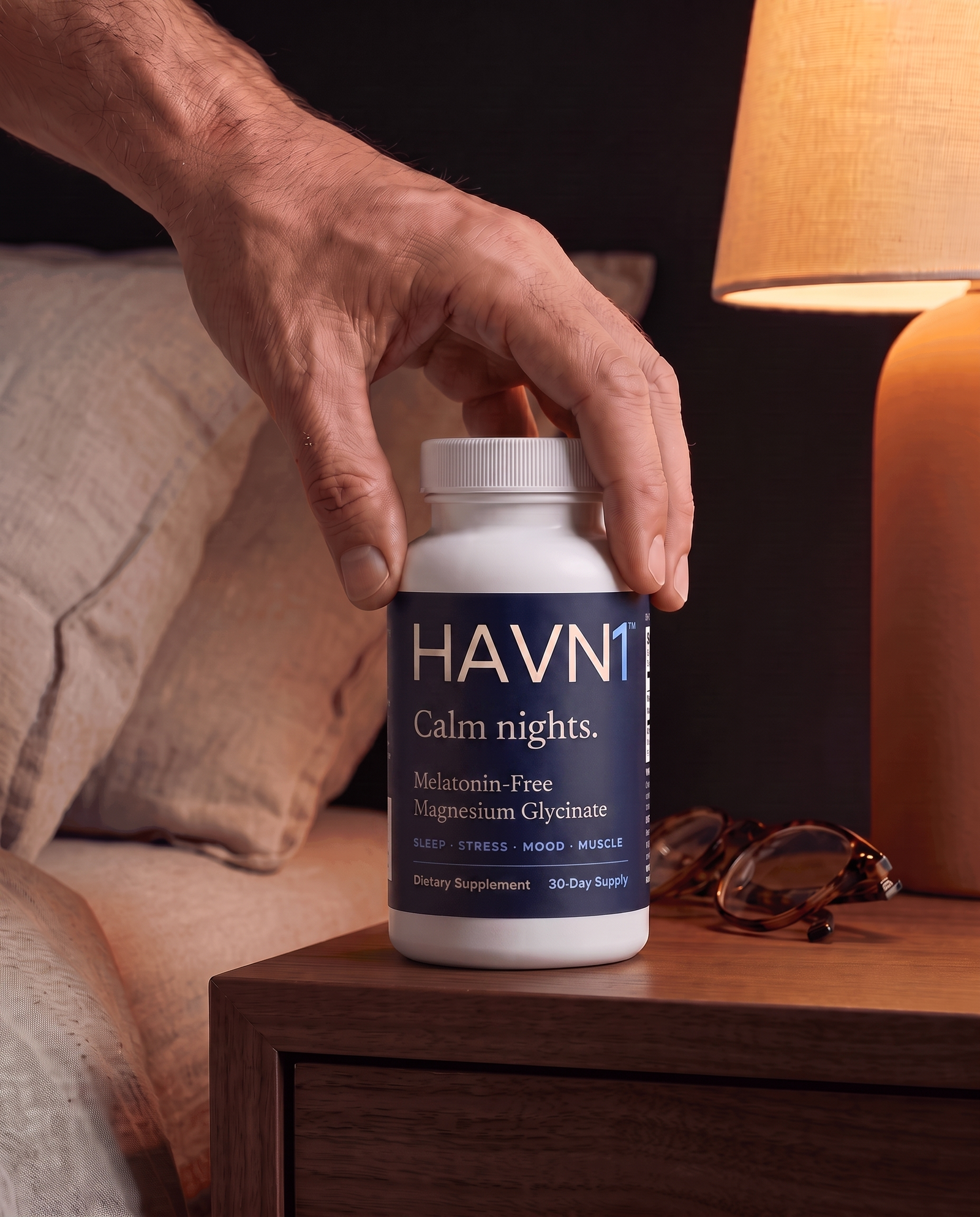 Three HAVN1 capsules held in an open palm