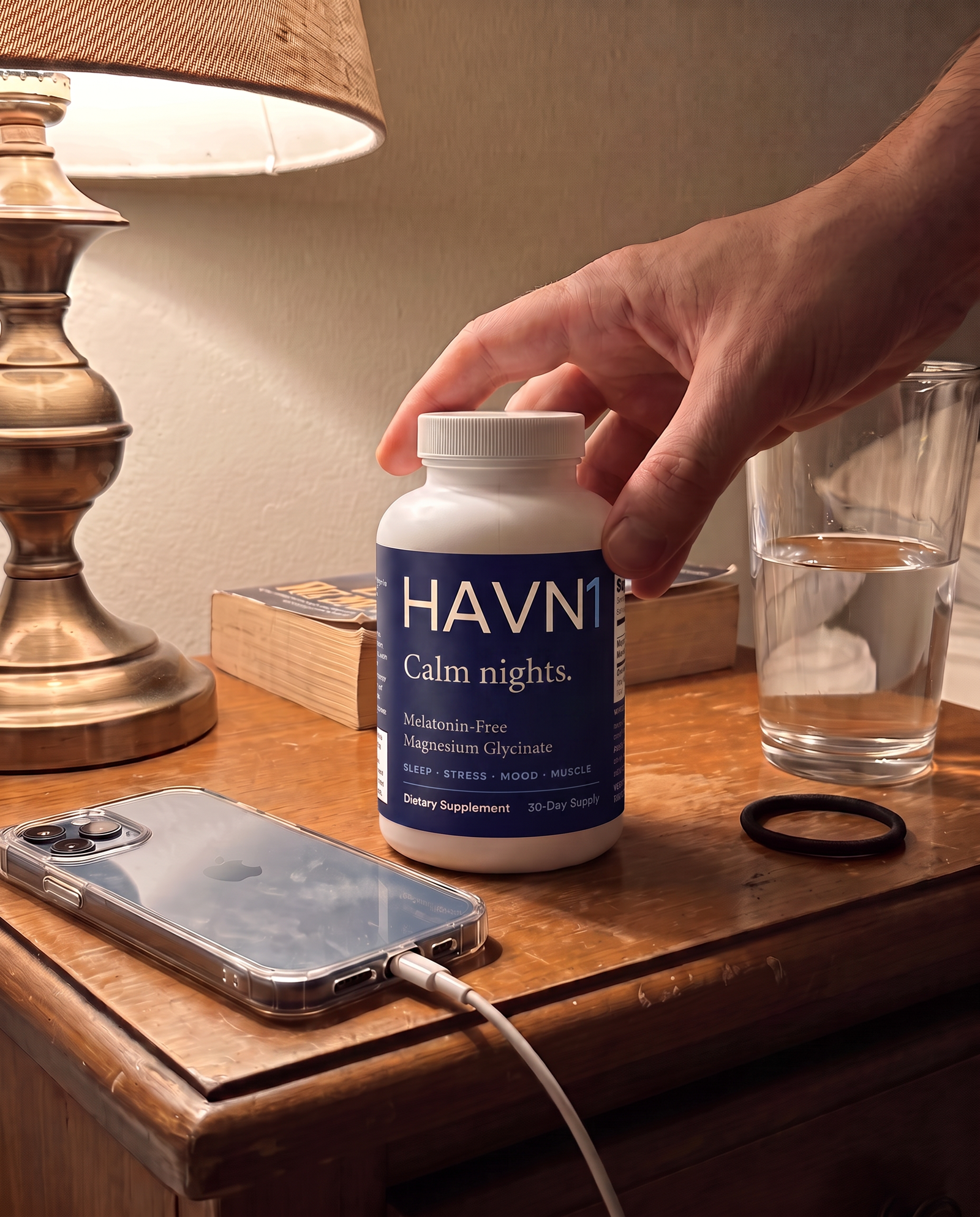 HAVN1 bottle on a nightstand beside a lamp at night